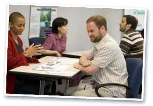 Photo: Man and women in meeting.