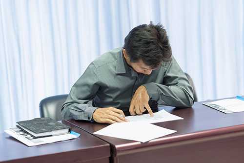 	A man working at this desk