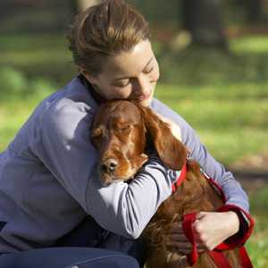 Woman hugging a dog