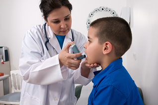 A school nurse administering an inhaler to a student