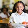 a student with a tray of healthy food