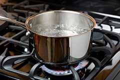 Pot of boiling water on stove