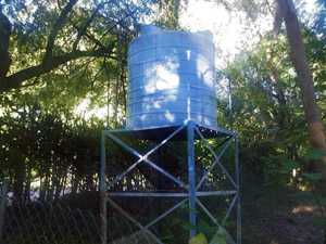 	picture of a cistern that resembles a large tank on a stand