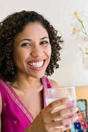 	Woman Drinking water and laughing.