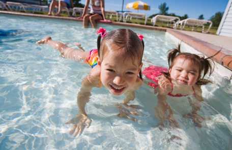 Photo: Young girls playing in pool