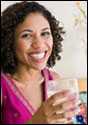 Photo: A woman with a glass of water.