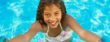 A girl in a swimming pool.