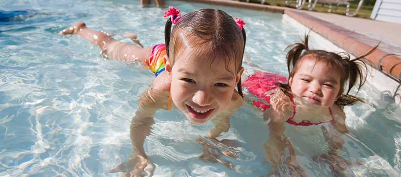 two girls swimming