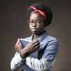 young African American female holding book