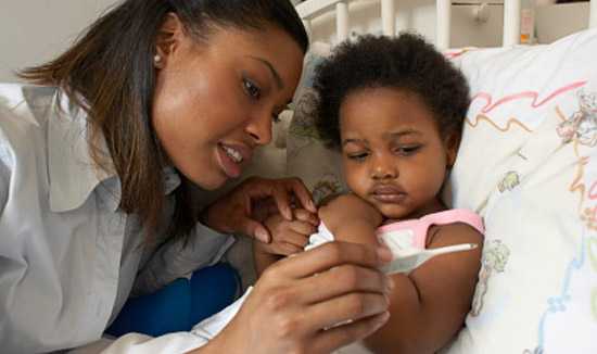 Mother taking child's temperature