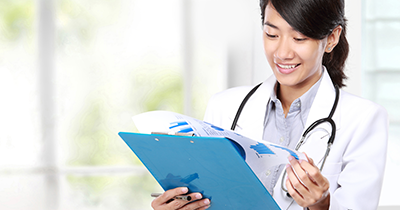 	Photo of a doctor examining a clipboard