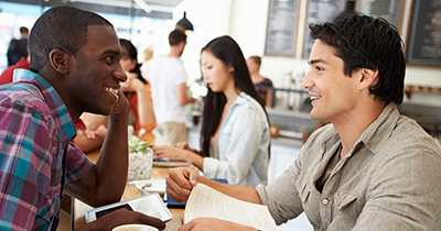 photo of two men in a restaurant