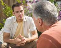 	photograph of two men in a yard