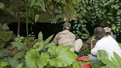 Hubert fellow entering cave in Thailand.