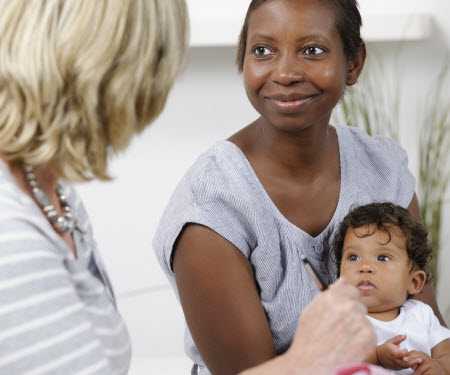 Nurse visiting a mother with a child