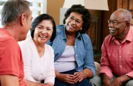 Group of four people talking