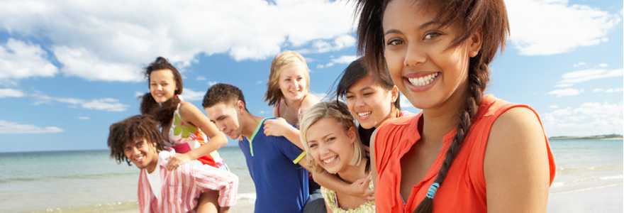 Teenagers walking on beach