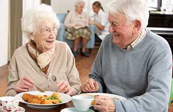 Middle aged couple eating