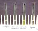 Colorimetric test for artesunate. From left to right: chloroquine, counterfeit artesunate, genuine artesunate, sulfadoxine-pyrimethamine. The genuine artesunate is distinguished by a positive yellow appearance. 