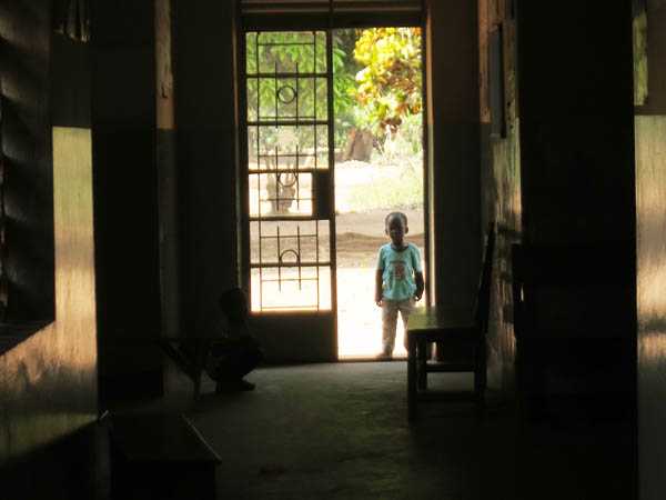 In Uganda, the smaller health centers are usually done seeing patients by mid-afternoon. When we visited Wabwoko Health Center one such afternoon, one of the health worker's child was playing outside, waiting for his mom to be done for the day. He kept peeking in, but was too shy to come in.