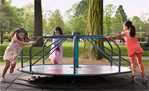 Children playing on a merry-go-round