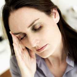 Photo: woman with her hand on her head