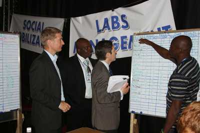 Dr. Frieden visits Sierra Leone’s Western Area Command Centre, where he reviews the Ebola results data from laboratories across Sierra Leone. Left to right: Dr. Oliver Morgan, Dr. Desmond Williams, Dr. Tom Frieden.