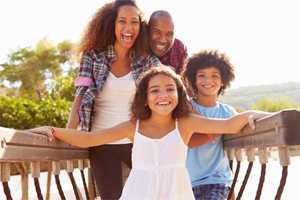 Happy family on a boardwalk