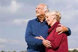 Photo: Elderly couple holding eah other 