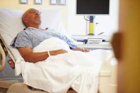 man in hospital bed