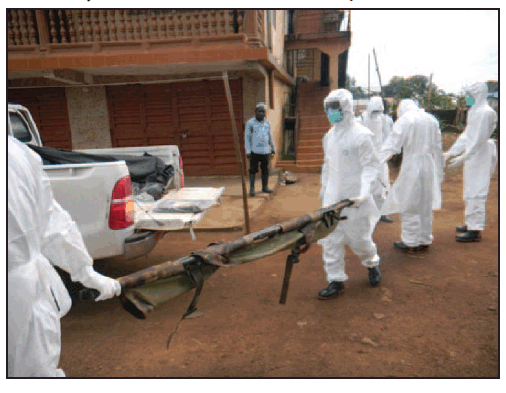 The figure is a photograph of a burial team preparing to collect another body and transport it in the back of truck, along with eight other bodies that had already been collected, in Sierra Leone in September 2014.