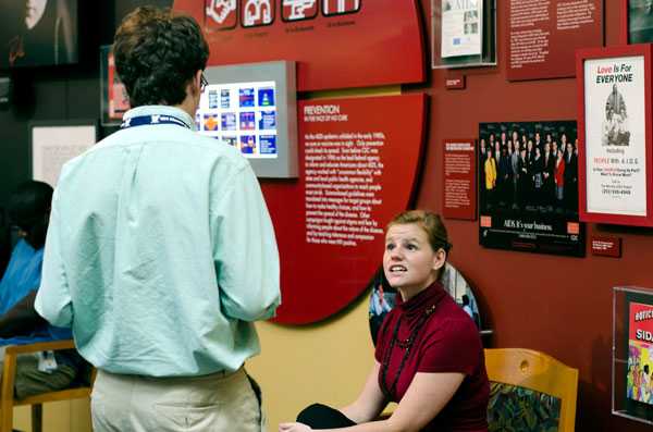 Simulated outbreak victim gives information to Disease Detective Camper.