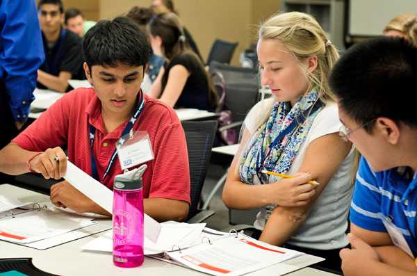 Team of campers comb through findings of their outbreak investigation.