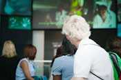 Student visitors take in the Global Symphony while being welcomed by David J. Sencer CDC Museum director, Judy Gantt.