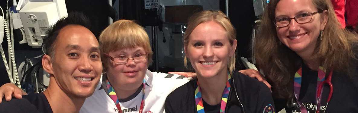 CDC staff taking a picture with a person that has a disability 