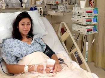 A patient in her hospital bed