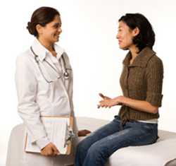 woman talking to doctor