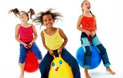 children bouncing on balls