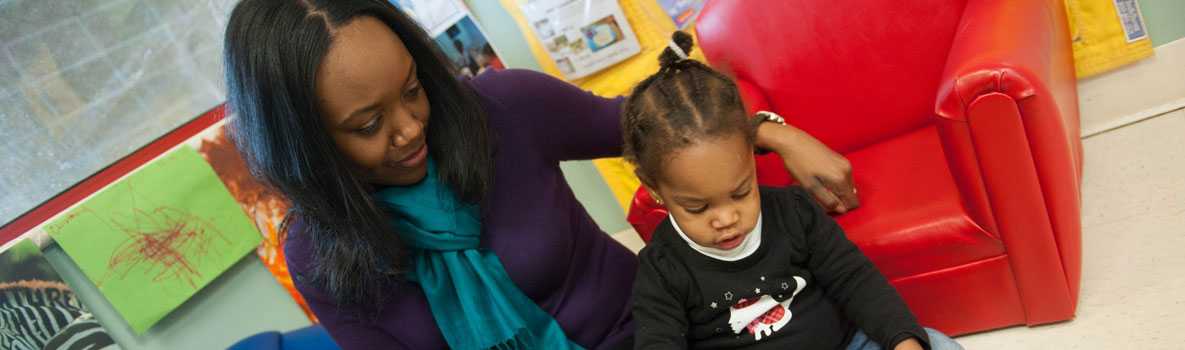 Mother and daughter reading book