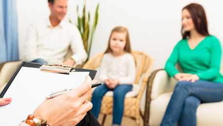 A family talking with their doctor