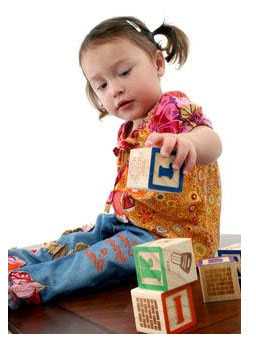 	Photo: Child playing with blocks