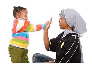 Photo: Mother playing with child