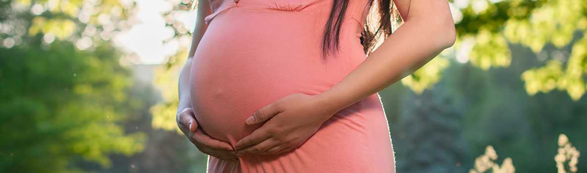 Pregnant woman in a park