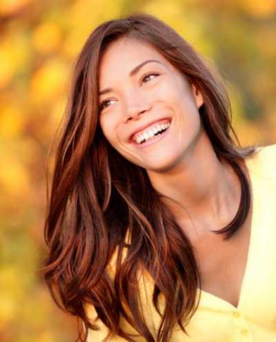 Woman with fall leaves in the background