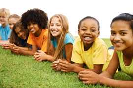 Kids laying on the grass