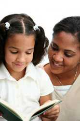 girl reading with mom