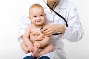 Doctor examining baby