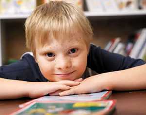 Boy with his head on his desk