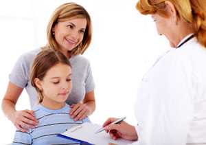 Doctor talking with a mother and daughter