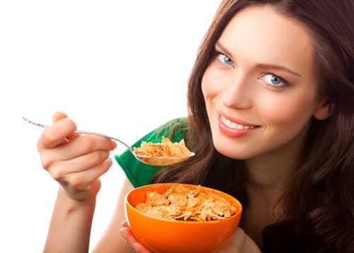 Woman eating cereal